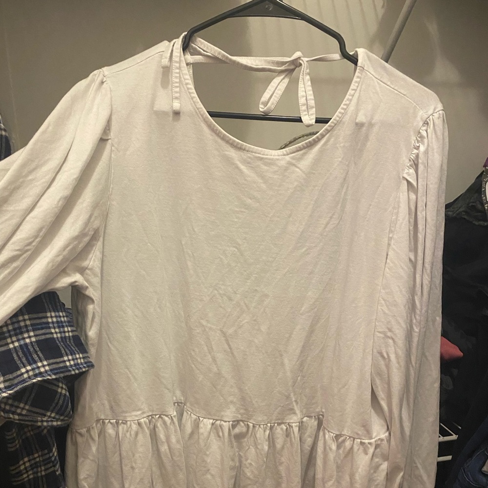 White peplum style loose fitting deep v back top
